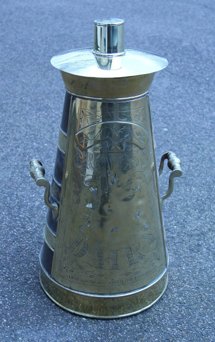 Vintage milk churn clad in brass
